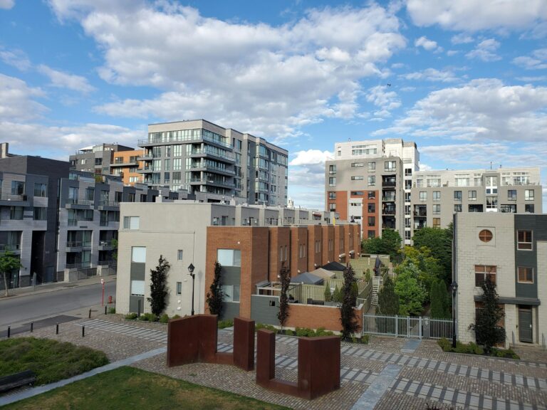 an apartment building near city buildings